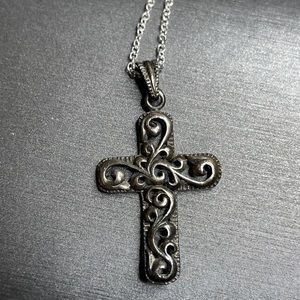 Vintage large sterling silver scroll work cross pendant.